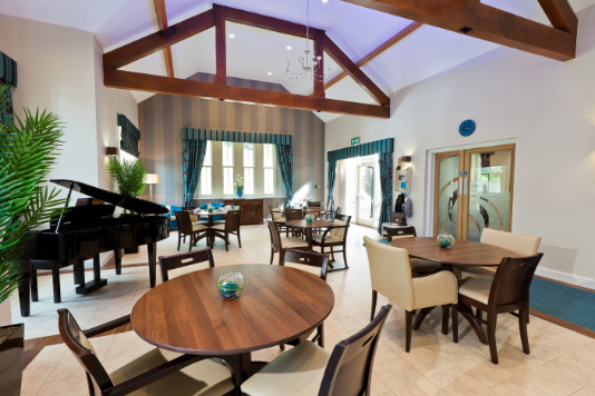 Dining area with a piano at Millbrook Care Home